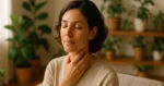 Person practicing vagus nerve stimulation for stress relief in peaceful home setting